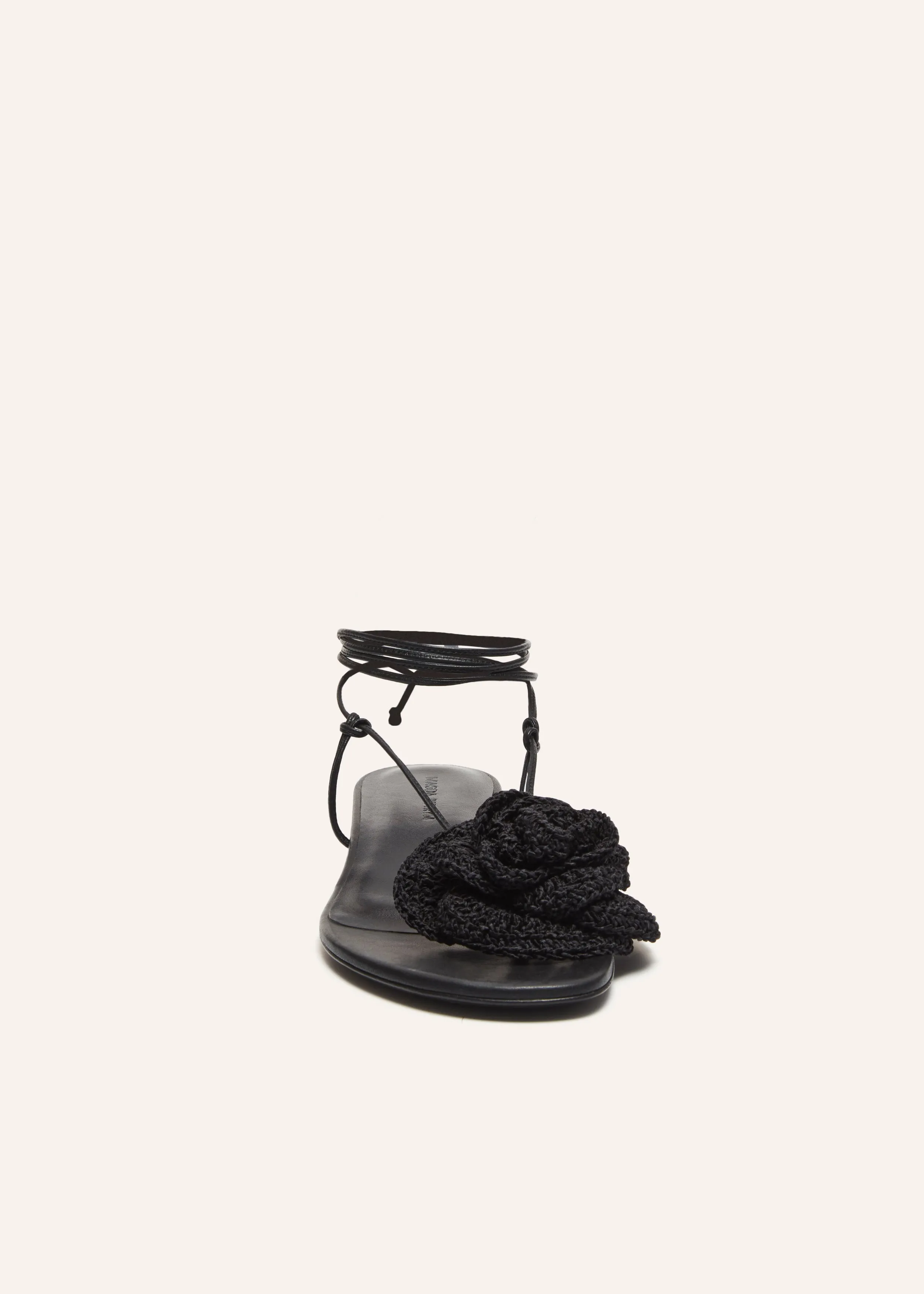 Wrap around flat flower sandals in black crochet