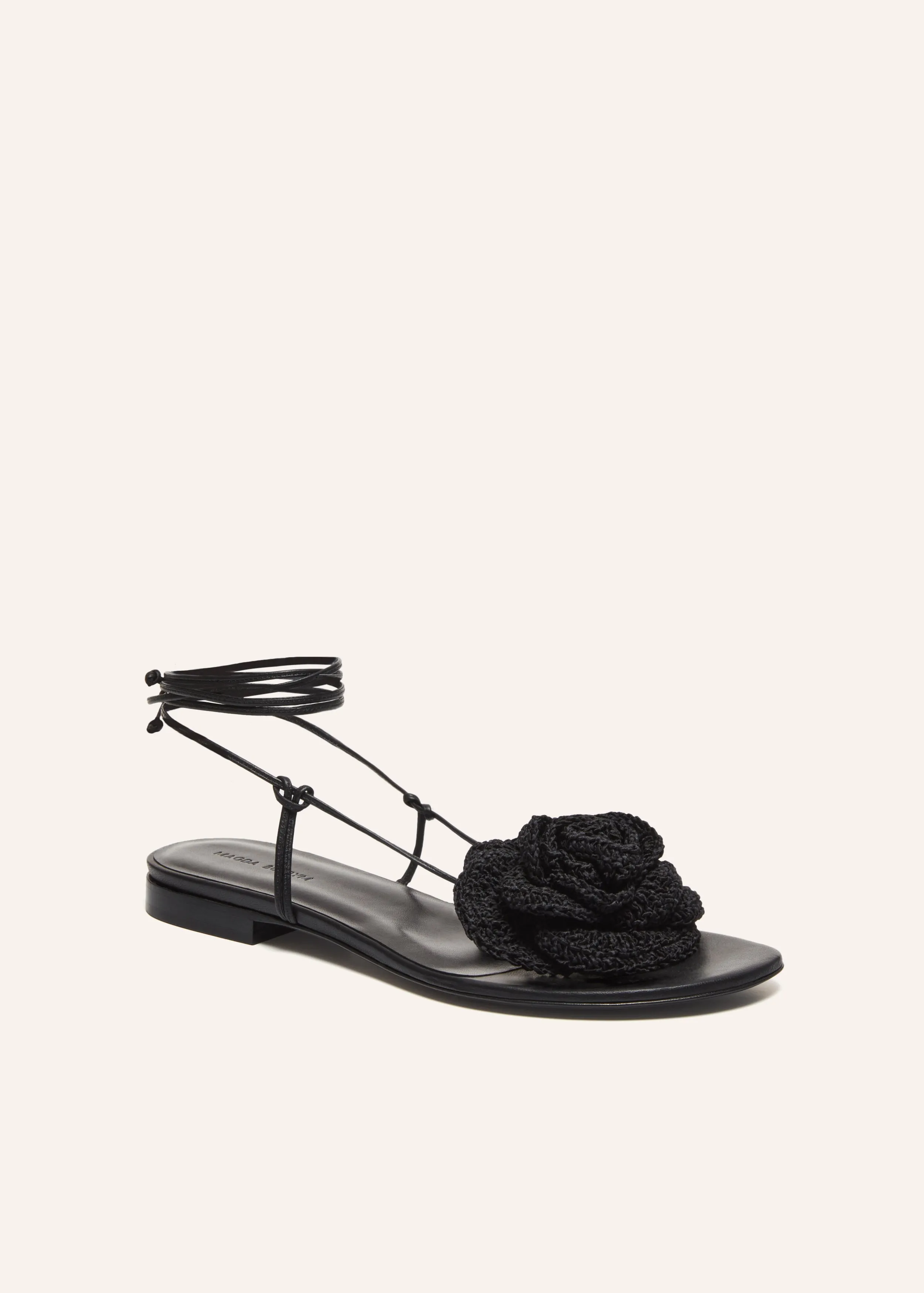 Wrap around flat flower sandals in black crochet